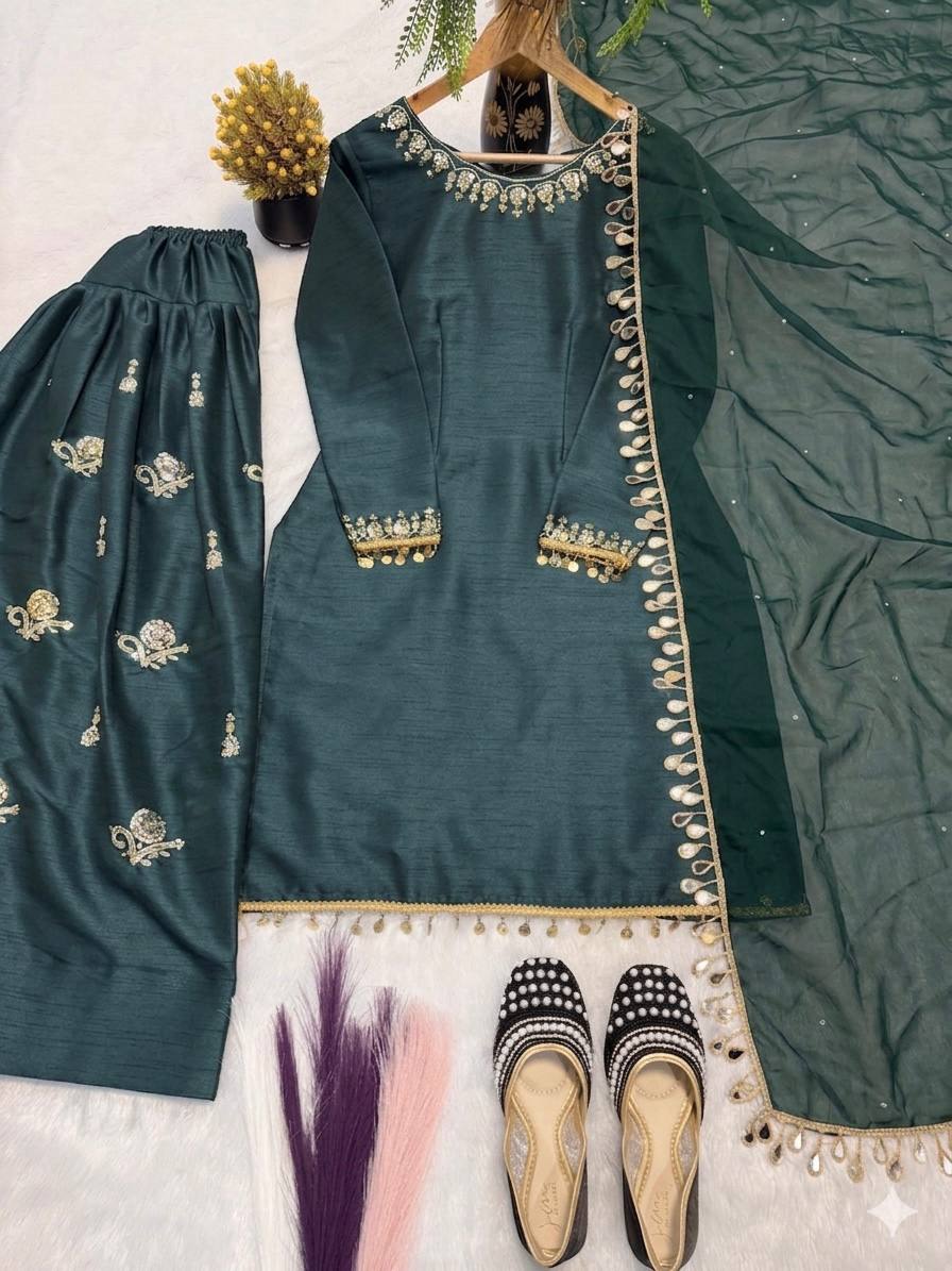 Majestic Emerald Green Kurta and Salwar Suit Set Featuring Intricate Gold Embroidery, Floral Motifs, and Ornate Coin Tassel Embellishments